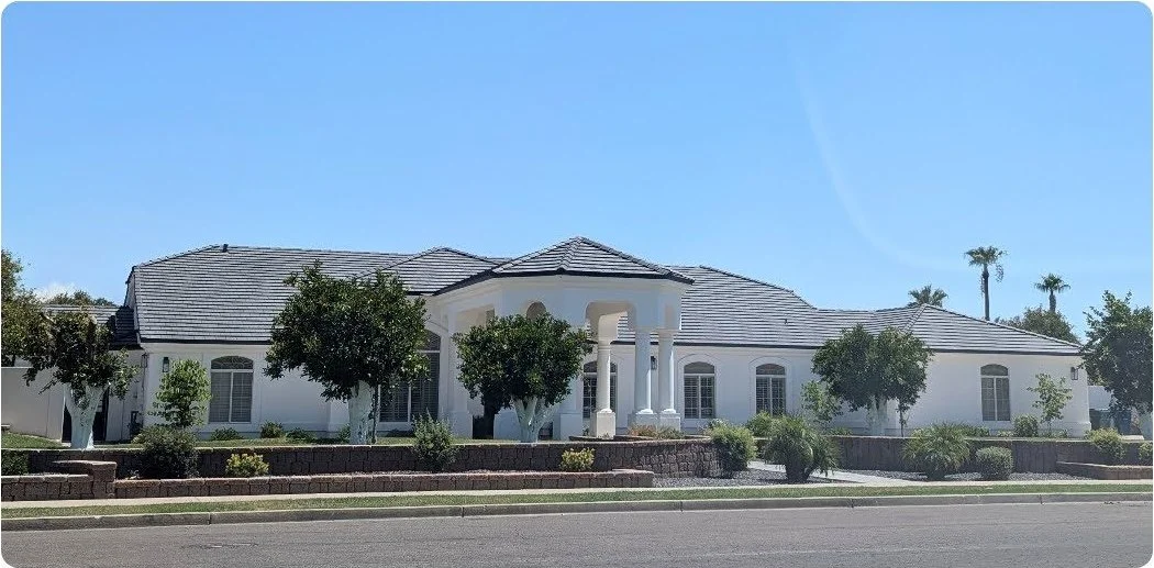 The same home after installation of a new flat concrete tile roof system