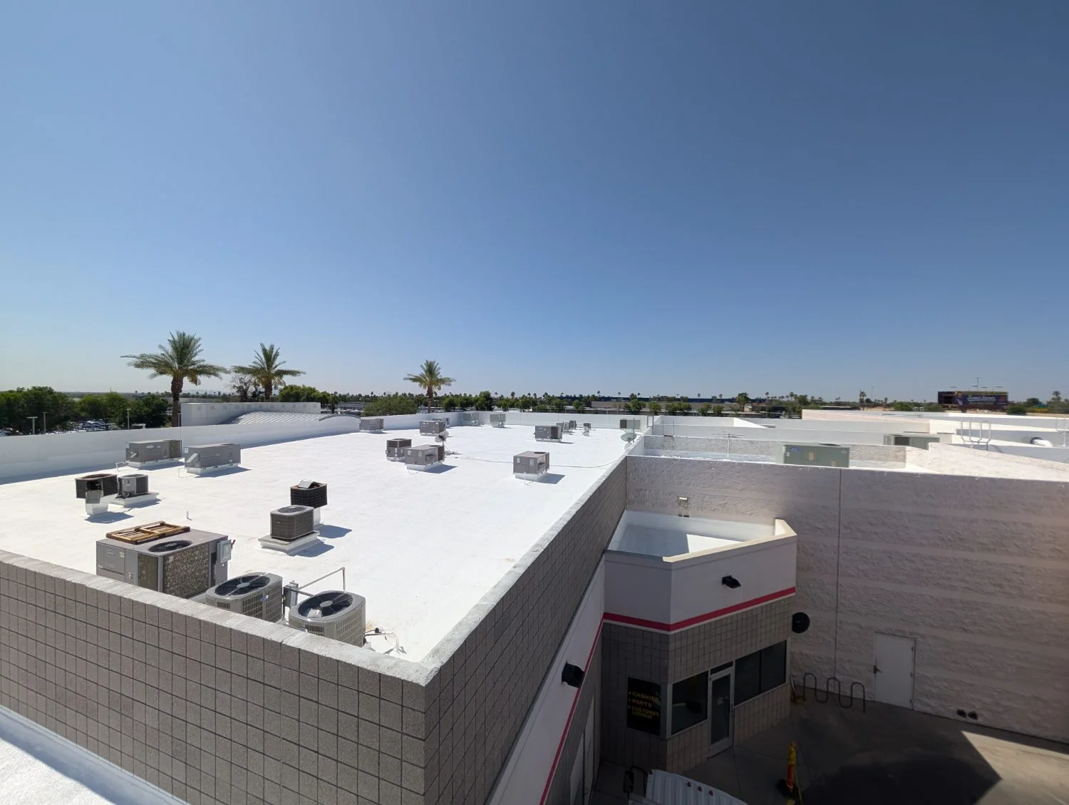 Commercial foam roof with HVAC units and equipment curbs