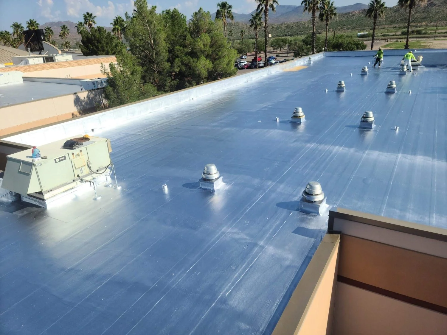 White elastomeric coating applied to a commercial foam roof