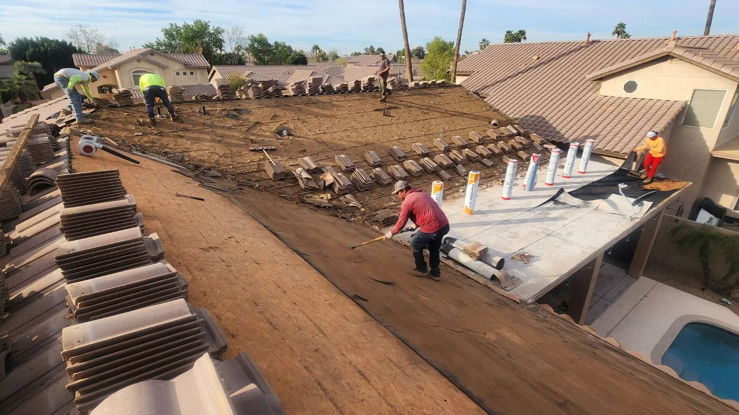 Tile stacked on the roof during an underlayment tear-off